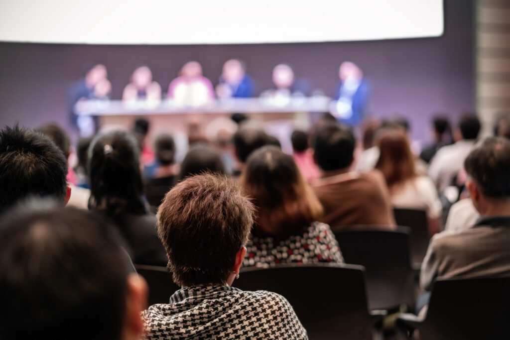 Rear view of Audience in the conference hall or seminar meeting